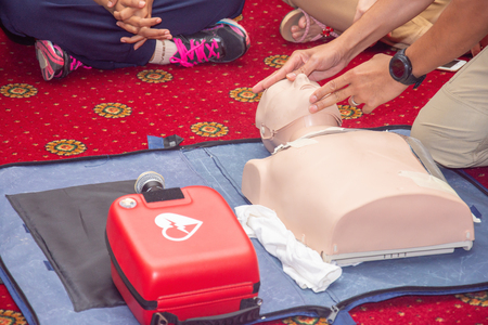 man open airway by head till chin lip in CPR and AED training courseの写真素材