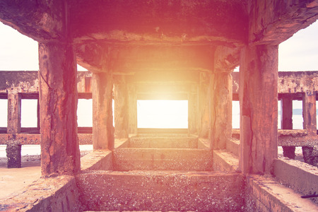 sun light in jetty and barnacle hold on the bridgeの写真素材