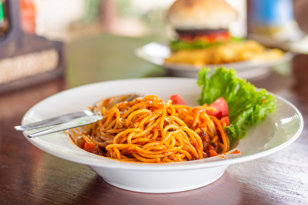 spaghetti italian food in the dish on tableの写真素材