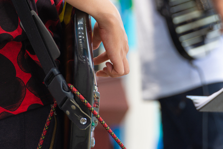 close up hand a man playing solo electronic guitarの写真素材
