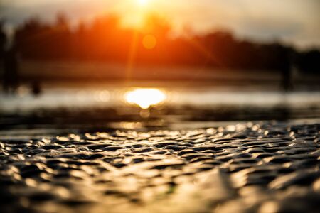 sand on the beach gold sun light and flare on summer vacation