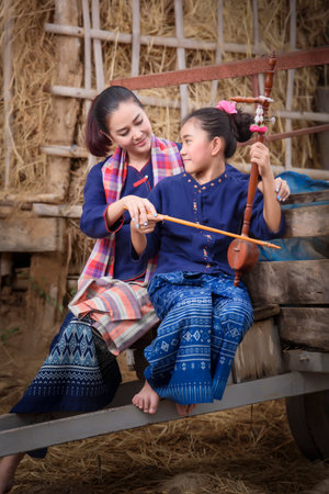 thai female in the rice field and cottage concept farmer lifestyle activityの写真素材