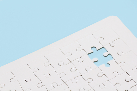 Missing jigsaw puzzle on blue backgroundの写真素材