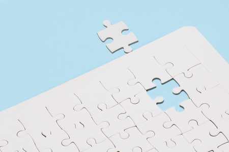 Missing jigsaw puzzle on blue backgroundの写真素材