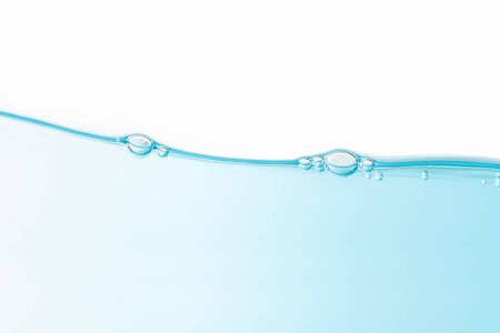 Air bubbles floating on wave. Water splash isolated on white background.の写真素材