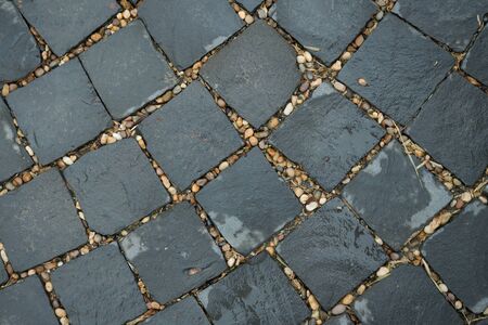 Wet stone pavement background after rainの写真素材