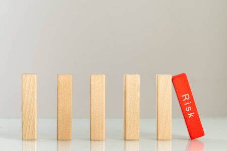Wood blocks domino for risk management concept.の写真素材