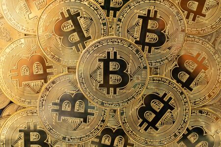 Top view of golden Bitcoins. Investment in virtual currency and cryptocurrency conceptの写真素材
