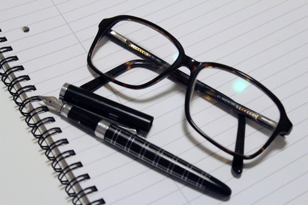 diary glasses and penの写真素材