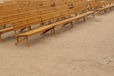 The Yellow benches of wood placed object on a sandy beachの写真素材