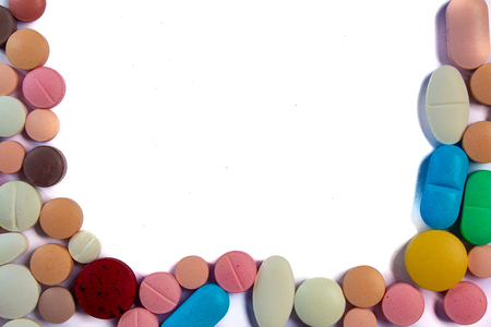 Drugs consumed orally. Colorful pills on a white backgroundの写真素材