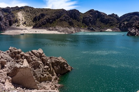 Wide view of the mountainous canyon. Great lake surrounded by mountains.の写真素材