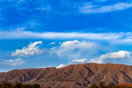 View of huge mountains illuminated by the sun.