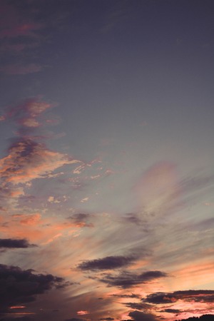 Isolated clouds of golden tones during sunset. Resource for designers. Sky in the fall of the sun.の写真素材