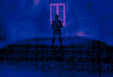 Ghostly figure in an empty room. Light painting photography.の写真素材