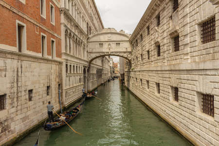 Venice Italy. May 15, 2018. Canals of Venice during a cloudy day. Ancient houses of the city of northern Italy. Touristic city.のeditorial素材