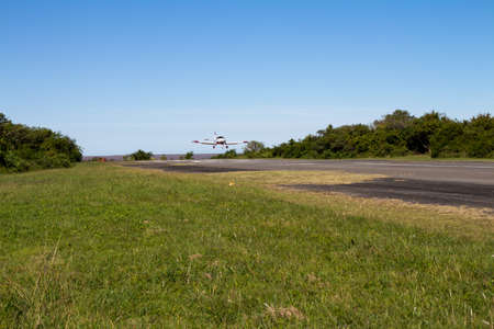 Martin Garcia Island, Argentina. February 23, 2017. Small propeller powered airplane landing at the airport of Martin Garcia Island.のeditorial素材
