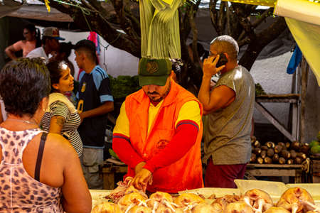 Goianinhia, Rio Grande do Norte. July 13, 2019. Shoppers at a farmers market. Open air market. Picturesque food market.のeditorial素材