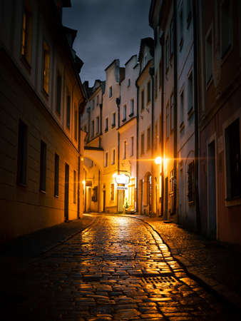 Pardubice, Czech Republic - December 22 2020: BartolomÄjskÃ¡ street in the historic center of the city Pardubice, Czechia with baroque buildings and the street lights during the early winter eveningのeditorial素材