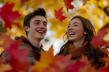 Young couple having fun in the autumn park. Love and relationships conceptの素材