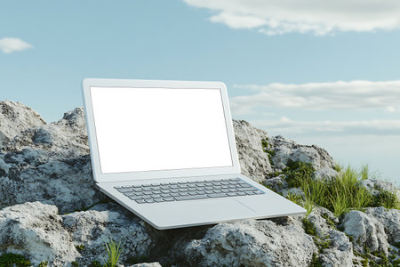 Laptop with white screen on the rock. 3d rendering.の素材