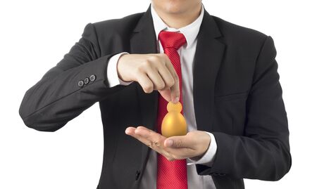 business man invest in gold egg , concept risk investment in trading assetの写真素材