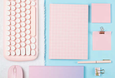 flat lay stationery on work desk in blue pastel backgroundの写真素材
