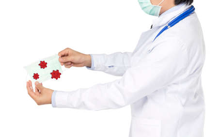 doctor show virus on face mask in white backgroundの写真素材