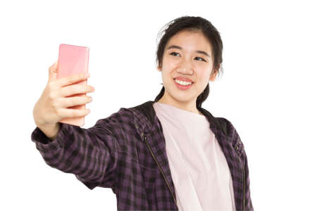 woman holding mobile phone take photo selfieの写真素材