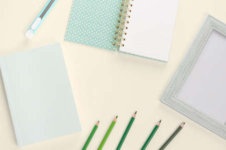 flat lay book stationery and pencil on yellow backgroundの写真素材