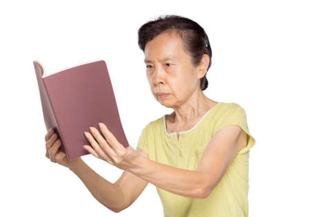 asian elderly woman reading from distance because farsightedness in white background