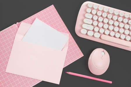 flat lay pink book and stationery on black backgroundの写真素材