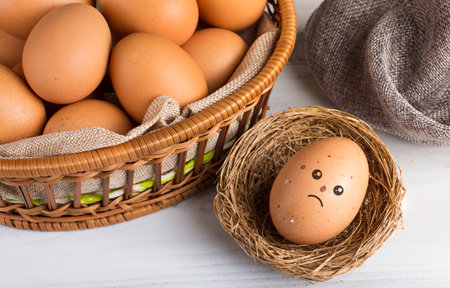 storage of fresh egg for cooking , selection chicken egg on white wooden backgroundの写真素材
