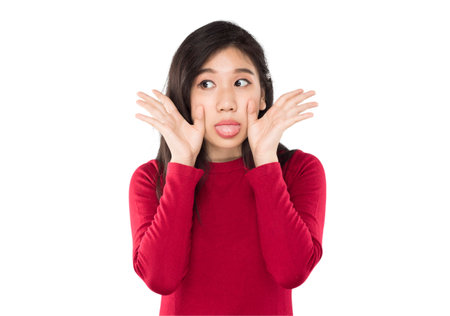 asian teenage girl making teasing gestures Showing joyful emotionsの写真素材