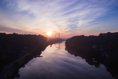 Sunrise at heavy factories near the riverの写真素材