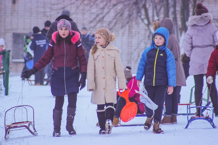 Zhytomyr, Ukraine - January 11, 2016: Sledding kids at winterのeditorial素材