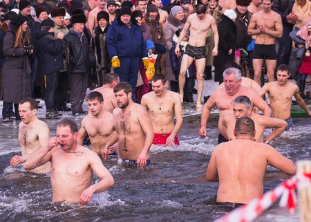 Zhytomyr, Ukraine - January 19, 2016: People celebrating epiphany at winter waterのeditorial素材