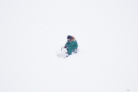 Zhytomyr, Ukraine - January 26, 2016: Man fishing on lake up viewのeditorial素材