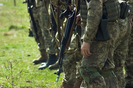 Military soldiers at tactical exercises with gunsの写真素材