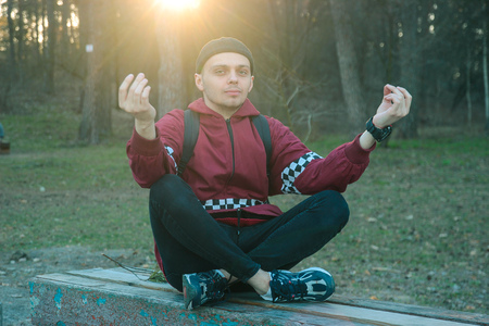 homeless man and woman fool around by posing yogaの写真素材