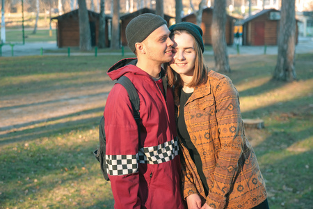 two happy homeless man and woman hold hands each other and bask in sunの写真素材