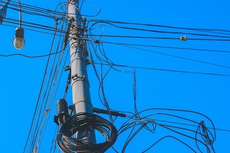 large number of ropes suspended disorderly on pole