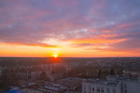 Beautiful evening town panorama with the dramatic skyの写真素材