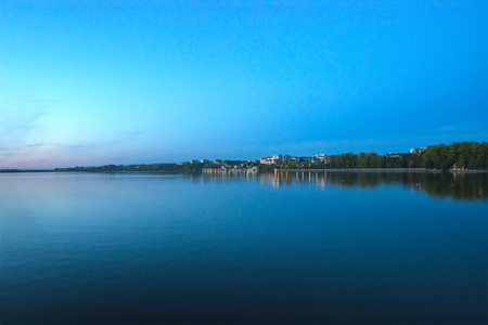 Night view of city embankment at boatの写真素材