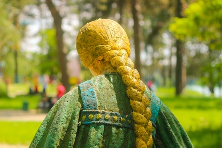 ukrainian girl statue at the park morningの写真素材