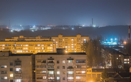 Evening spent on the roof with moon and fogの写真素材