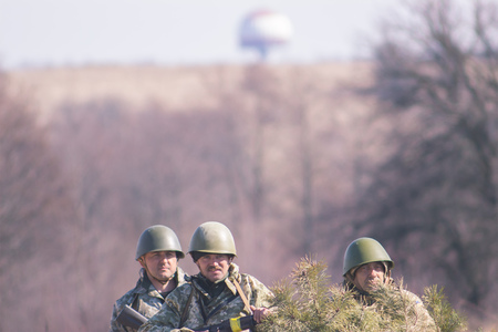Zhytomyr, Ukraine - March 5, 2015: Front Line. Military attack on battlefield with guns from ambush