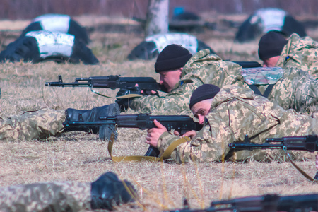 Zhytomyr, Ukraine - March 5, 2015: Front Line. Military attack on battlefield with guns from ambushのeditorial素材