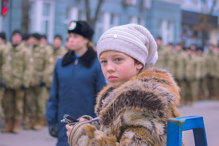 Zhytomyr, Ukraine - February 26, 2016: Girl on Military military parade, rows of soldiers at middayのeditorial素材