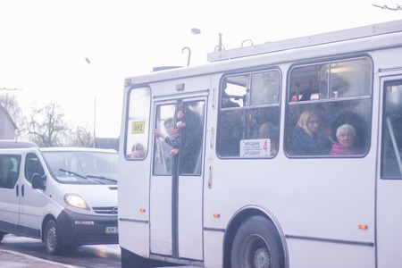Zhytomyr, Ukraine - September 10, 2014: Large group of angry People going by busのeditorial素材
